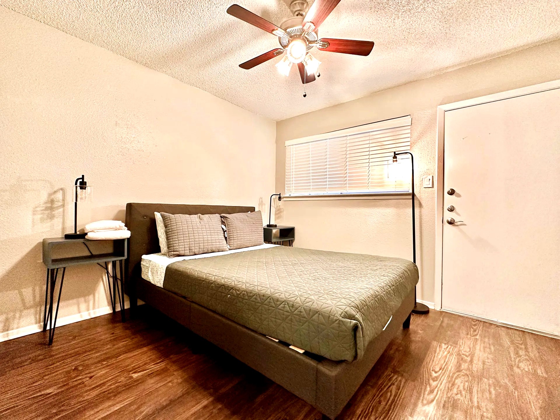 2808 Whitis Avenue, Unit C207 Austin, TX 78705 - Photo 3 of 5 a bedroom with bed and wooden floor