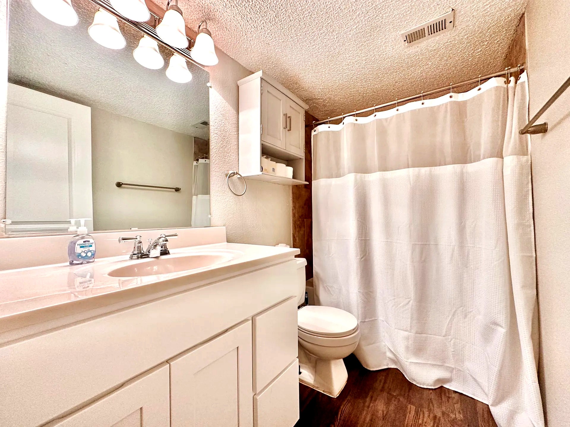 2808 Whitis Avenue, Unit C207 Austin, TX 78705 - Photo 4 of 5 a bathroom with a sink and a mirror