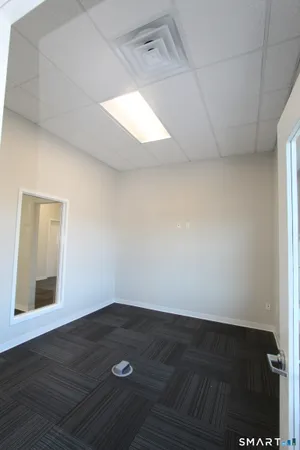 an empty room with wooden floor