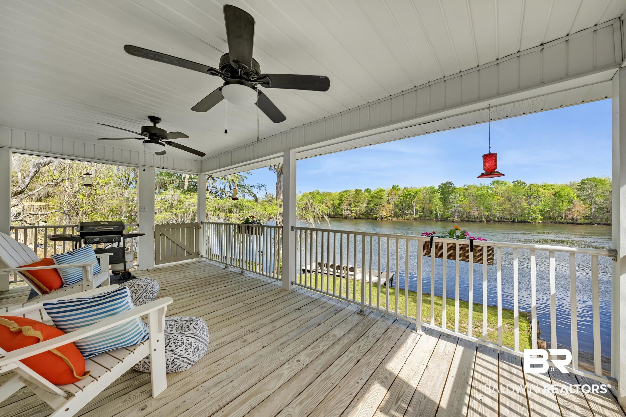 8081 Bryant's Lndg Road Stockton, AL 36579 - Photo 16 of 48 Wooden deck with a water view, a ceiling fan, and grilling area