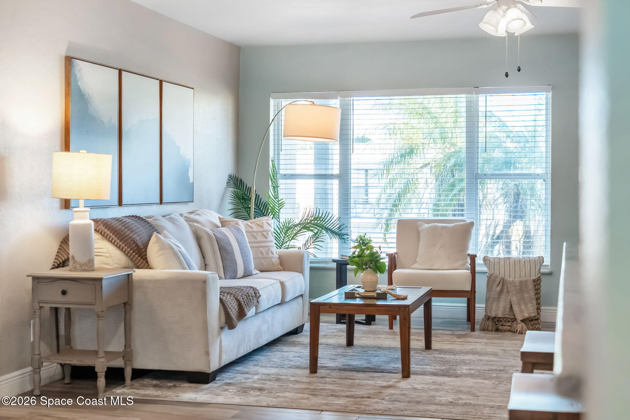 340 West Exeter Street Satellite Beach, FL 32937 - Photo 28 of 39 a living room with furniture and a lamp