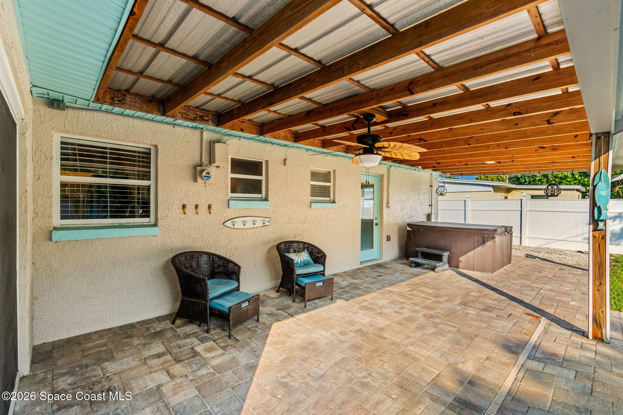 340 West Exeter Street Satellite Beach, FL 32937 - Photo 29 of 39 a view of a chairs and table in the patio
