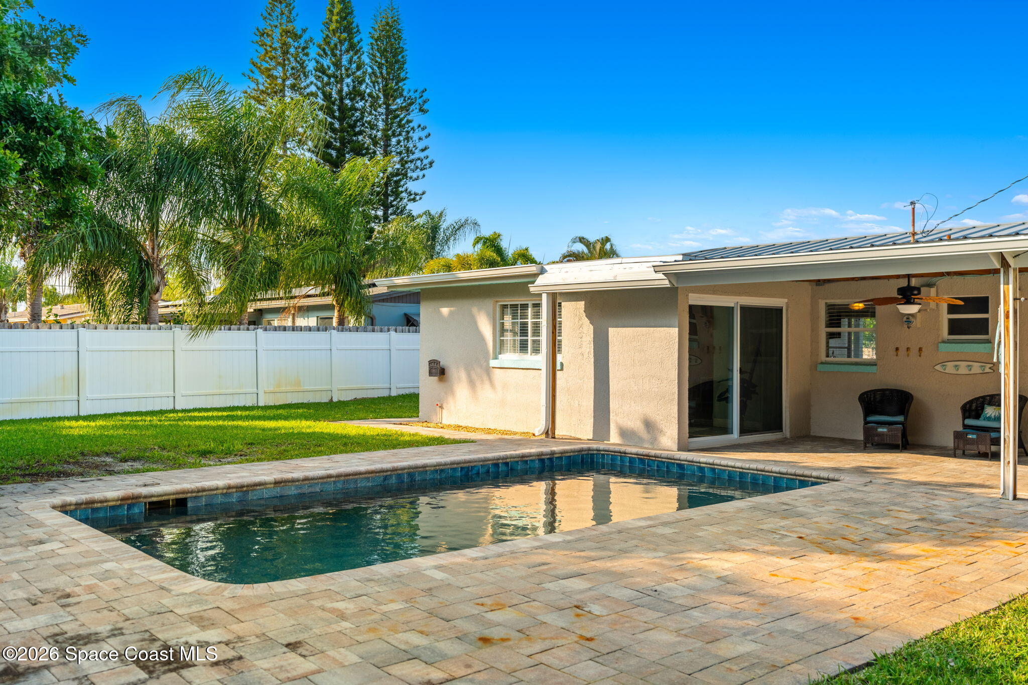 340 West Exeter Street Satellite Beach, FL 32937 - Photo 33 of 39 a view of a house with a swimming pool