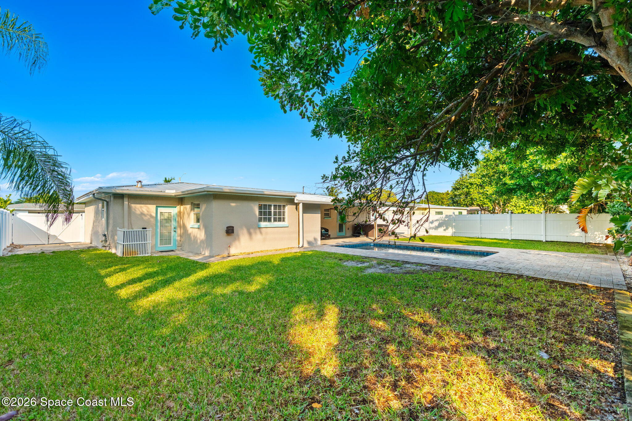 340 West Exeter Street Satellite Beach, FL 32937 - Photo 36 of 39 a front view of a house with a yard