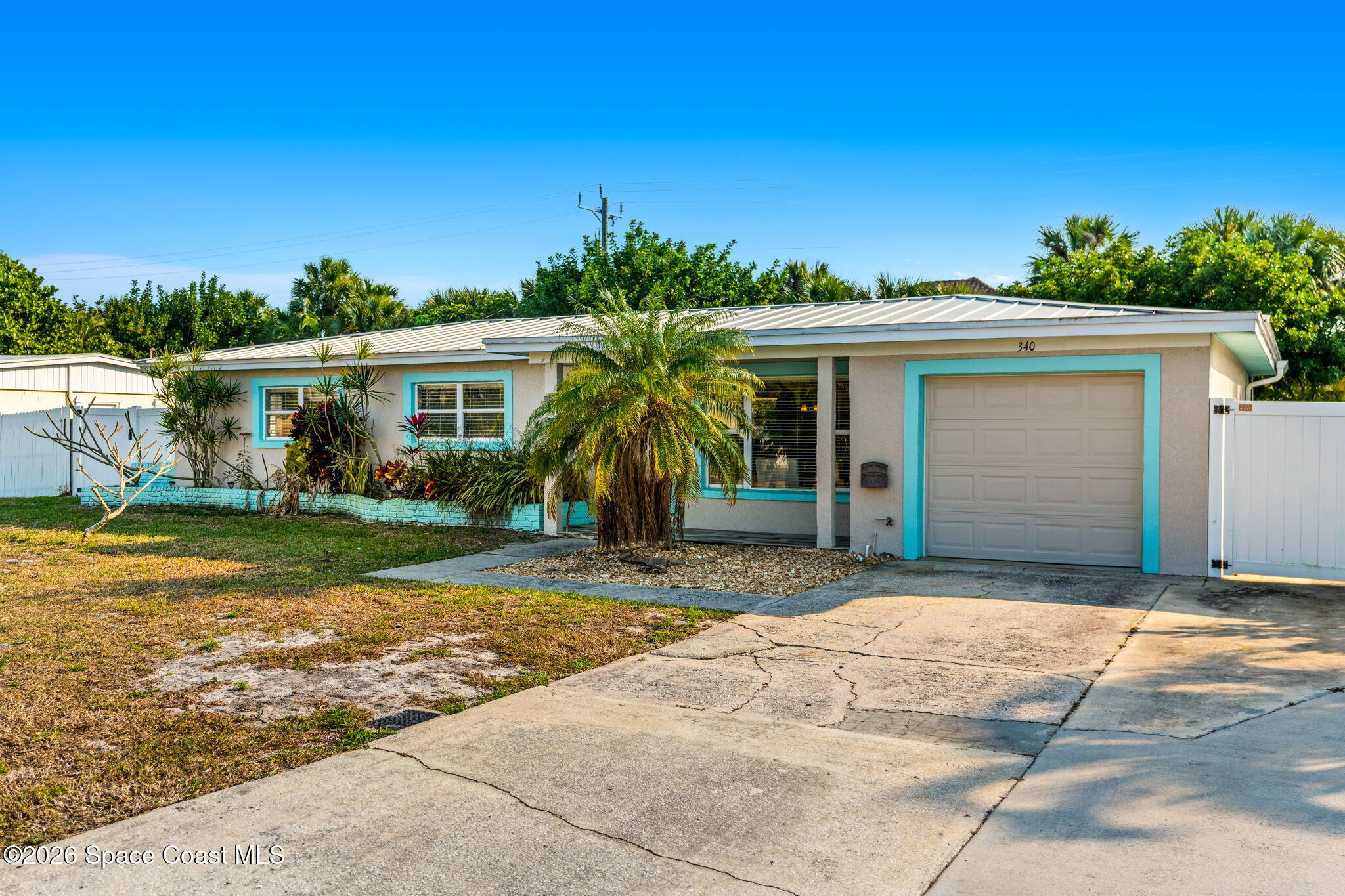340 West Exeter Street Satellite Beach, FL 32937 - Photo 38 of 39 a front view of house with yard
