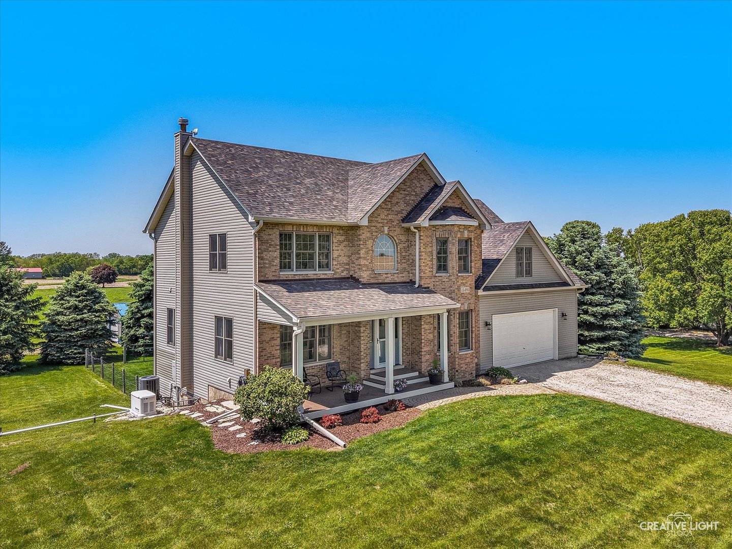 13495 Fennel Road Newark, IL 60541 - Photo 3 of 43 a front view of a house with garden