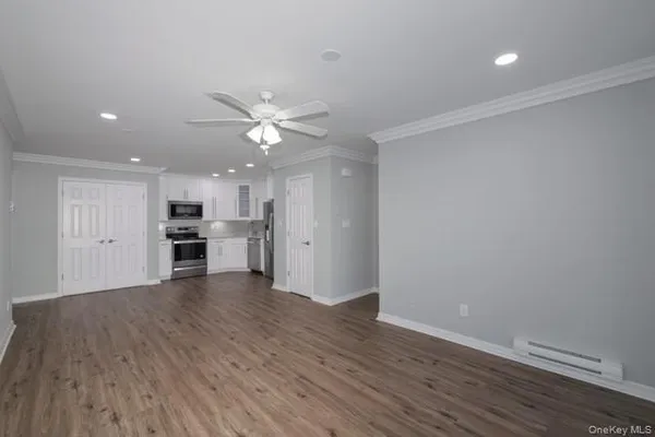 a view of kitchen with wooden floor and window
