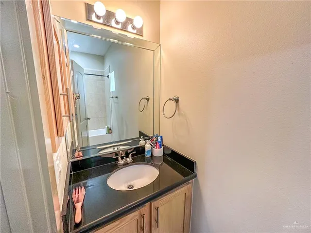 a bathroom with a sink and a mirror