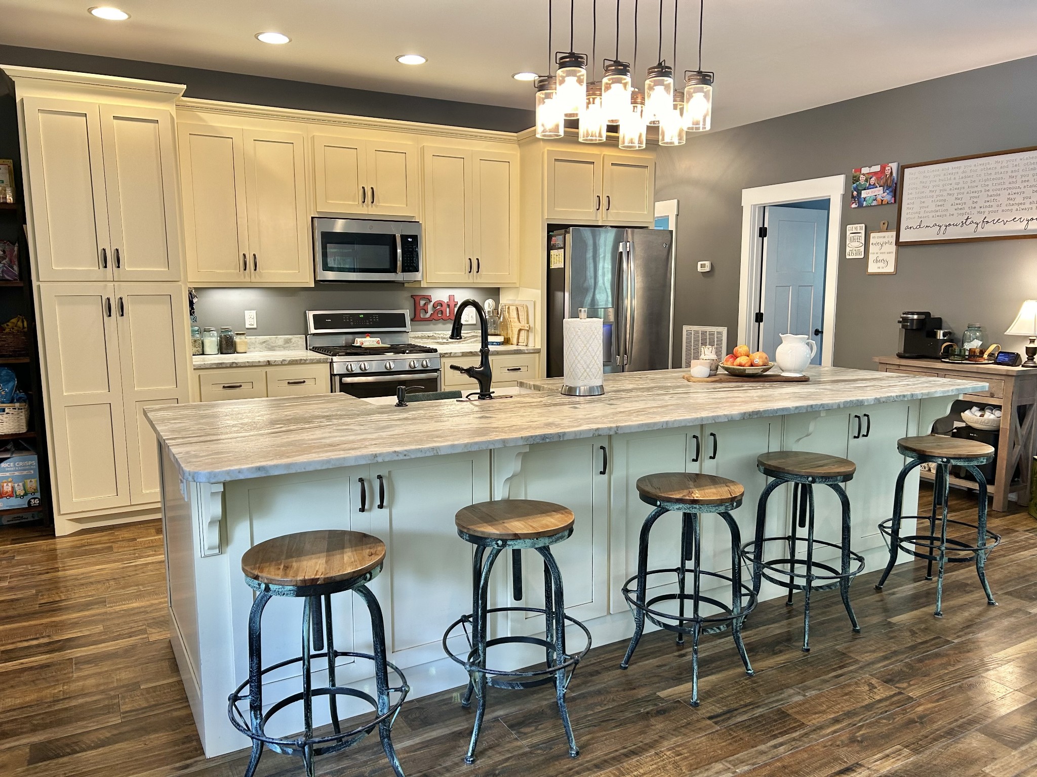 795 Cat Creek Road Manchester, TN 37355 - Photo 24 of 58 a kitchen with stainless steel appliances a table chairs refrigerator and sink