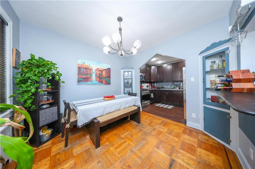 1200 East 49th Street Brooklyn, NY 11234 - Photo 15 of 30 a living room with patio furniture and a chandelier