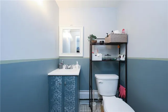 a living room with furniture potted plant and a window