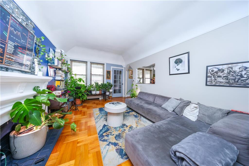 1200 East 49th Street Brooklyn, NY 11234 - Photo 21 of 30 a living room with furniture potted plant and a window