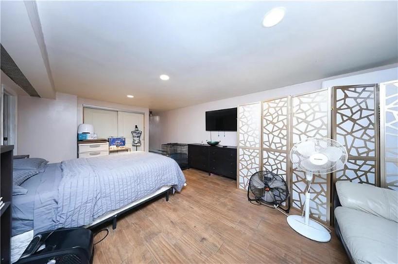 1200 East 49th Street Brooklyn, NY 11234 - Photo 28 of 30 a bed room with a bed and a television