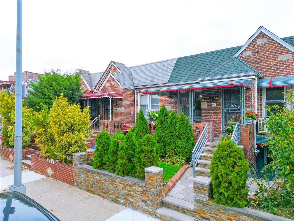 1200 East 49th Street Brooklyn, NY 11234 - Photo 4 of 30 a front view of a house with garden