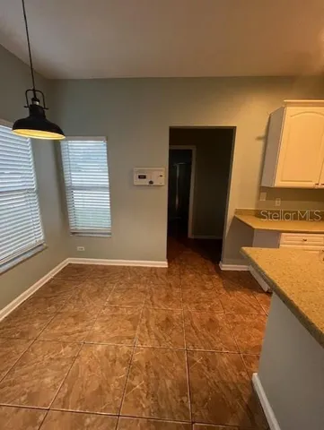 a view of an empty room and window