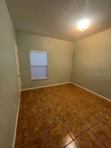 en empty room with windows