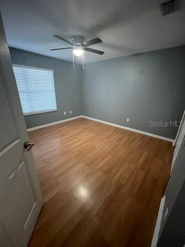 en empty room with wooden floor