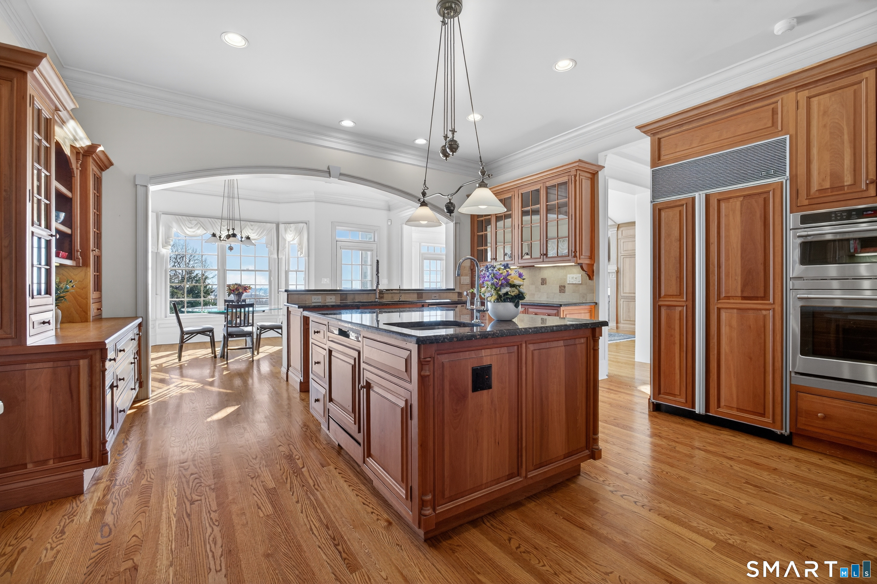 134 River Road Essex, CT 06426 - Photo 11 of 39 a kitchen with stainless steel appliances granite countertop wooden floors and view