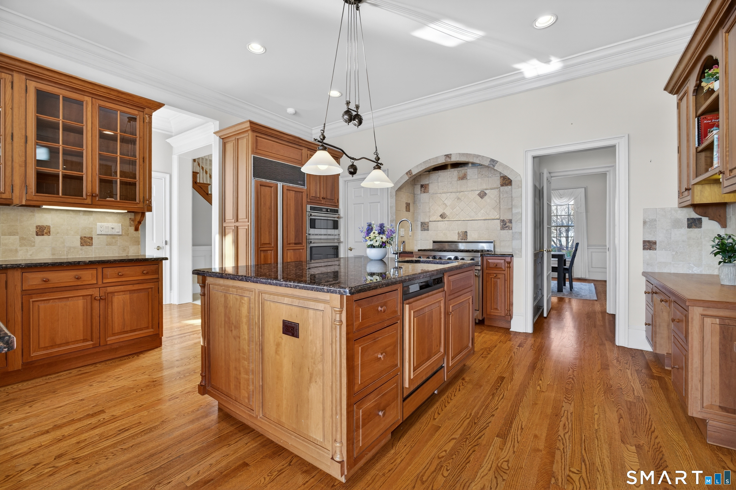 134 River Road Essex, CT 06426 - Photo 12 of 39 a kitchen with stainless steel appliances granite countertop wooden floors and sink