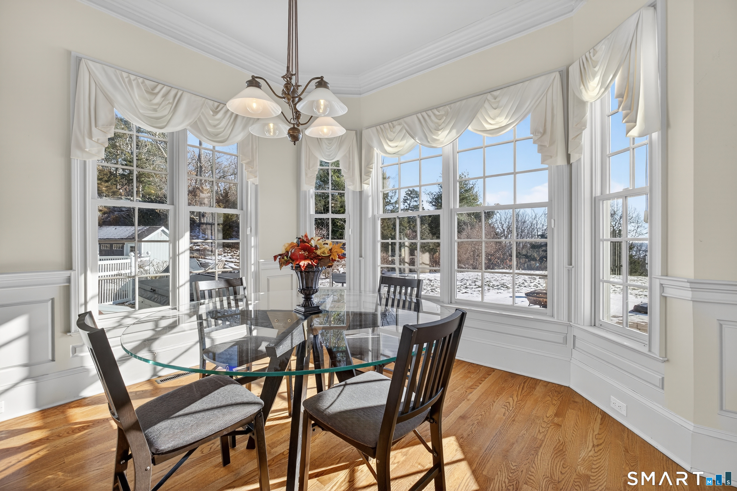 134 River Road Essex, CT 06426 - Photo 15 of 39 a dining room filled with furniture and chandelier