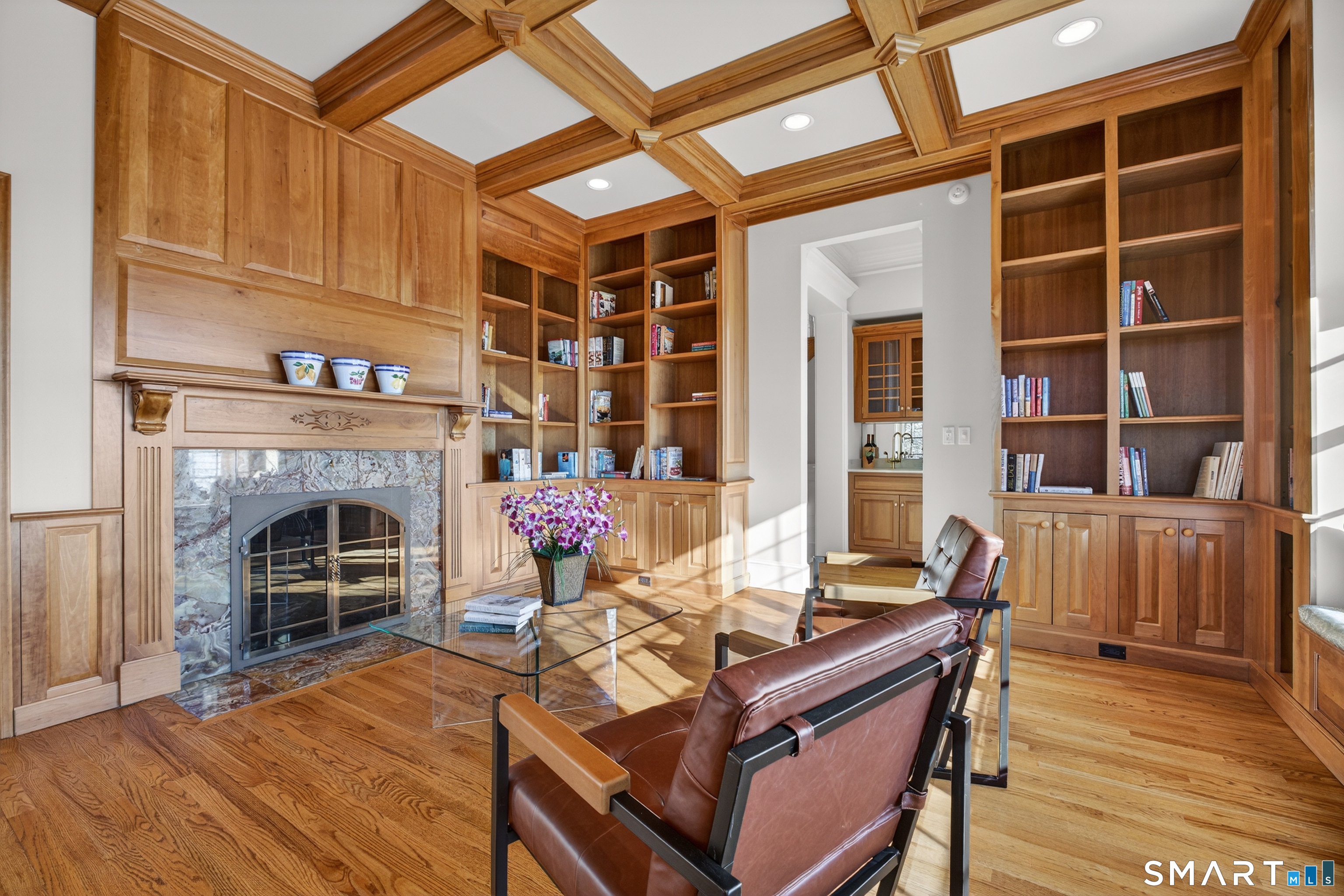 134 River Road Essex, CT 06426 - Photo 18 of 39 a living room with furniture a fireplace and a wooden floor