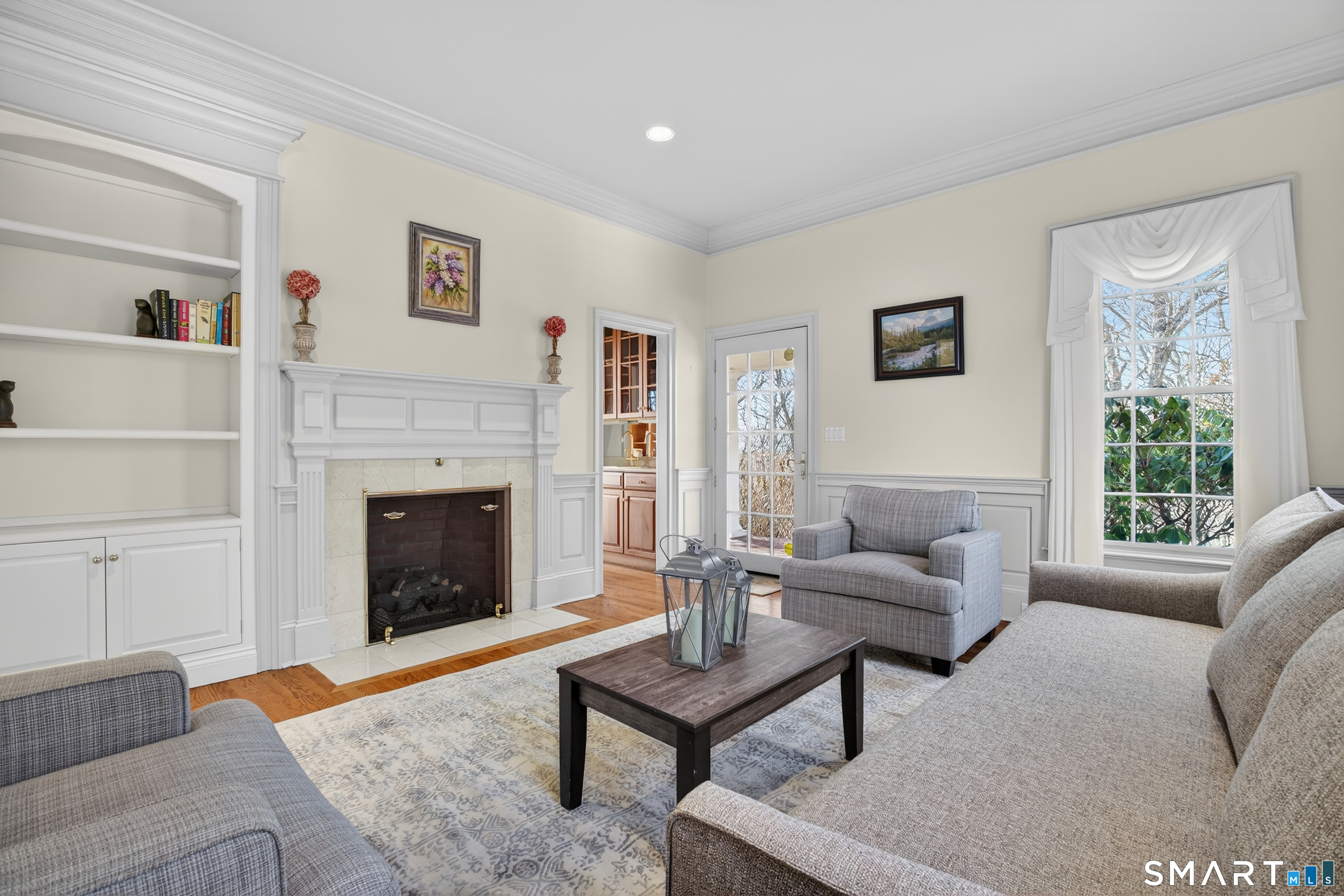 134 River Road Essex, CT 06426 - Photo 20 of 39 a living room with furniture and a fireplace
