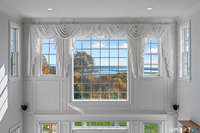 a front view of a house with entryway and windows