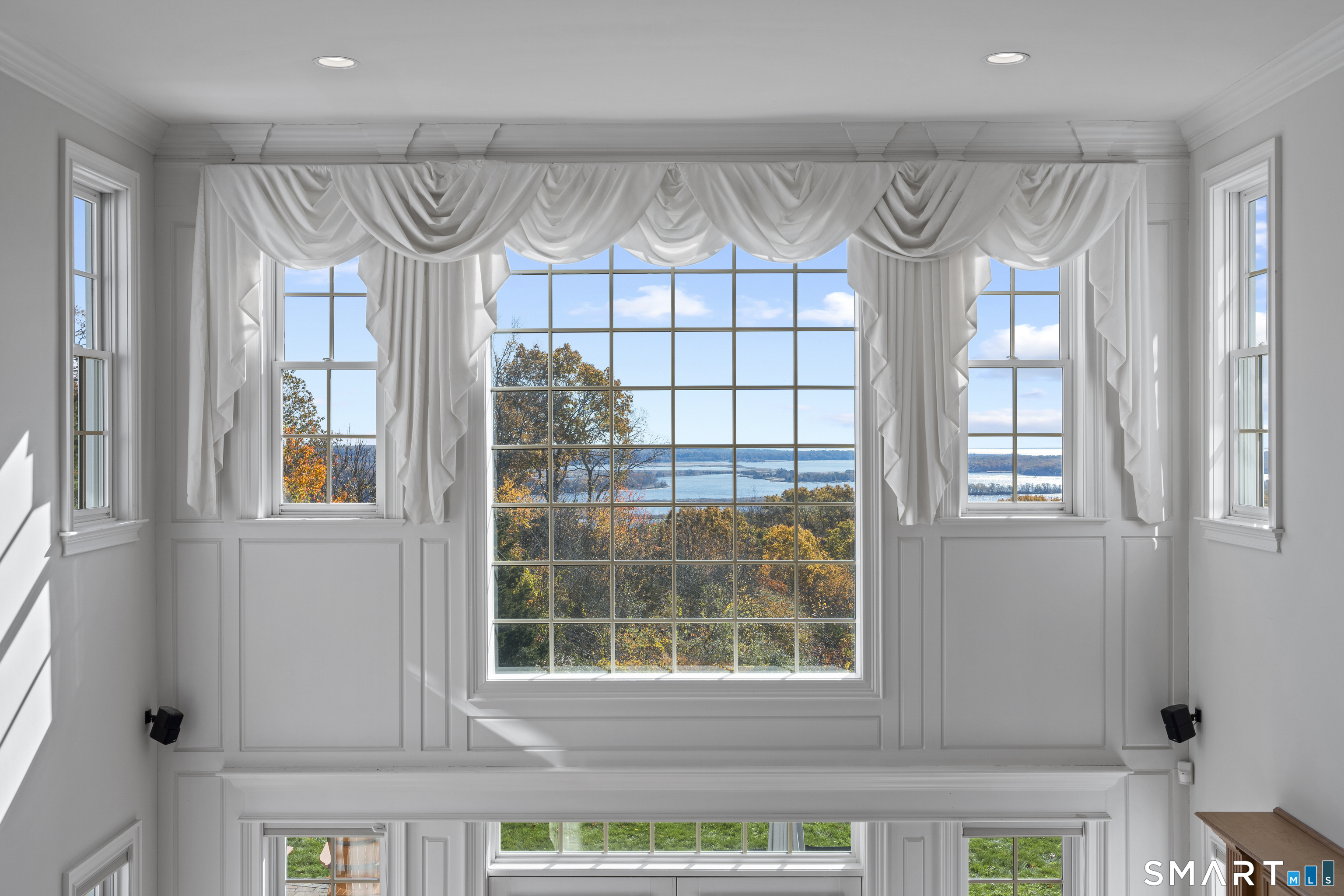 134 River Road Essex, CT 06426 - Photo 23 of 39 a front view of a house with entryway and windows