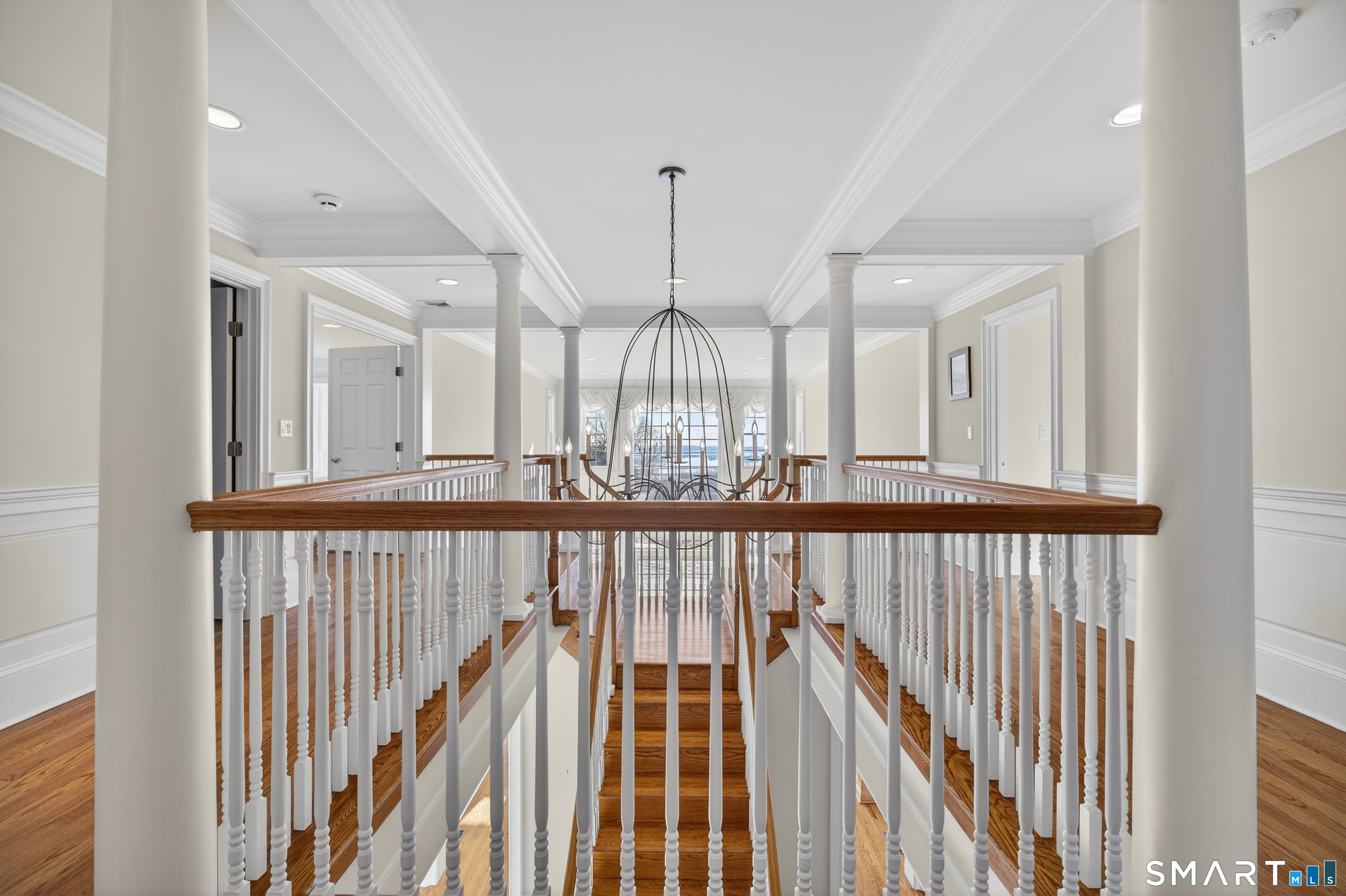 134 River Road Essex, CT 06426 - Photo 24 of 39 a view of a hallway with wooden floor and windows