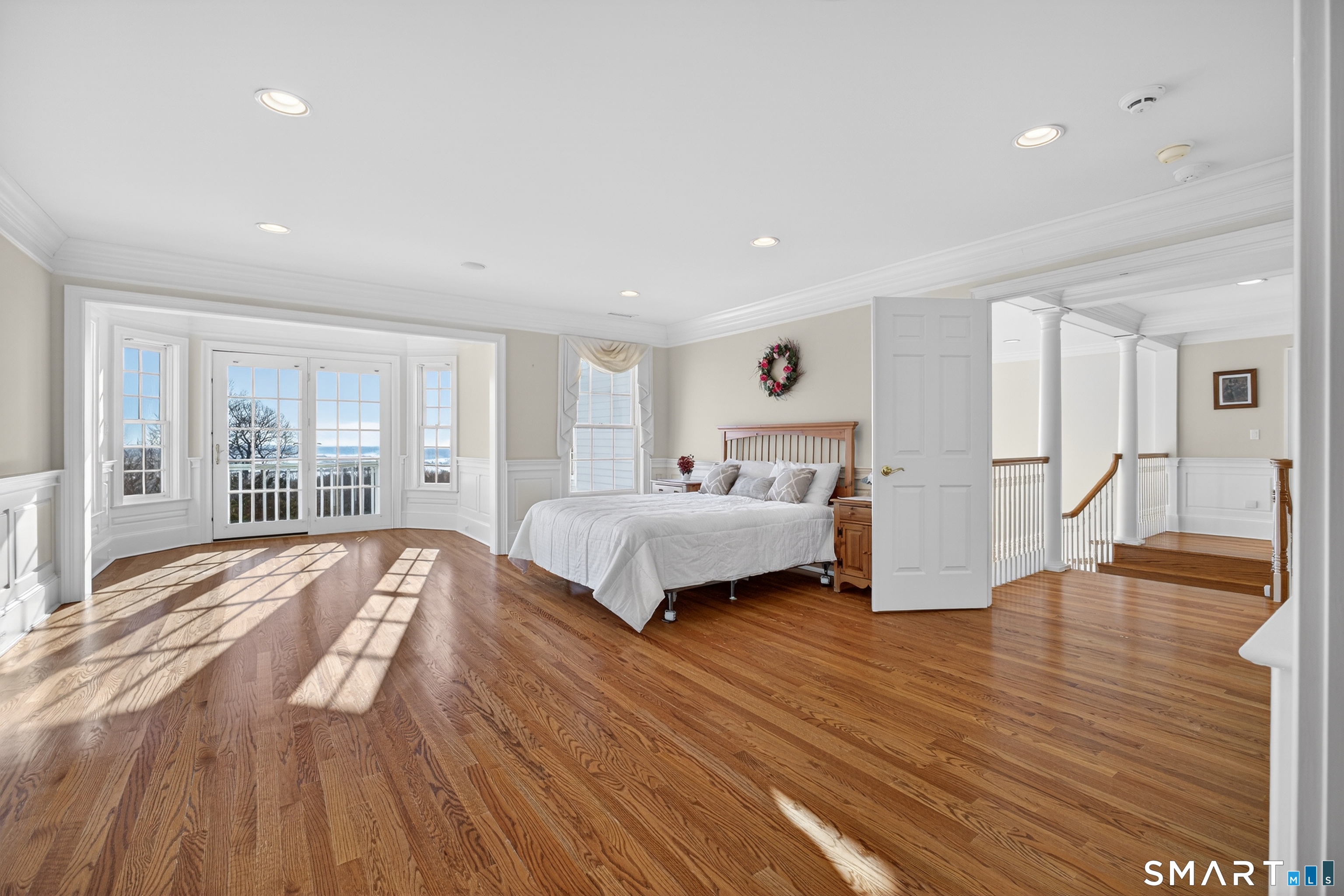 134 River Road Essex, CT 06426 - Photo 25 of 39 a spacious bedroom with a bed and a large window