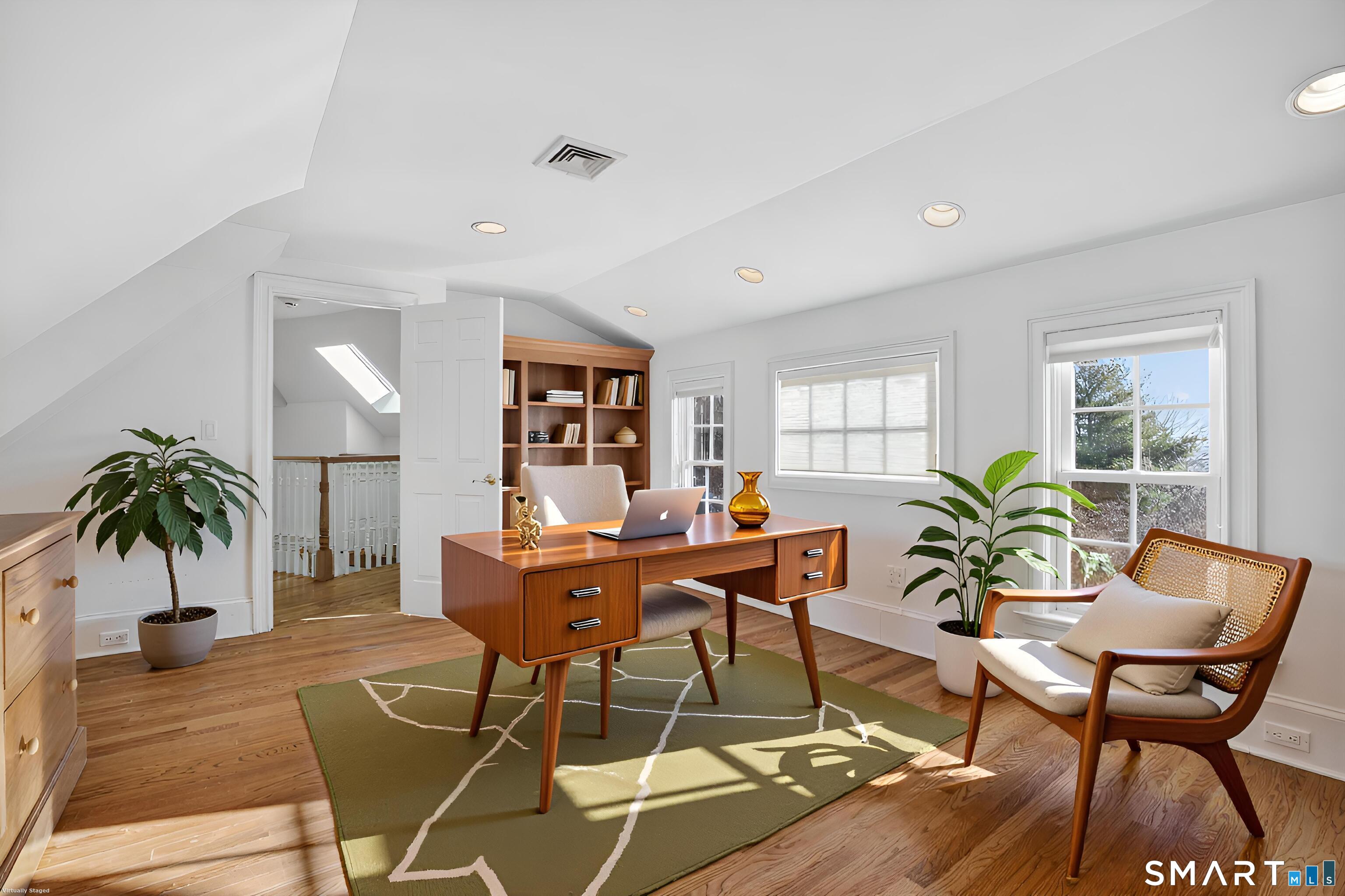 134 River Road Essex, CT 06426 - Photo 28 of 39 a living room with furniture and a potted plant