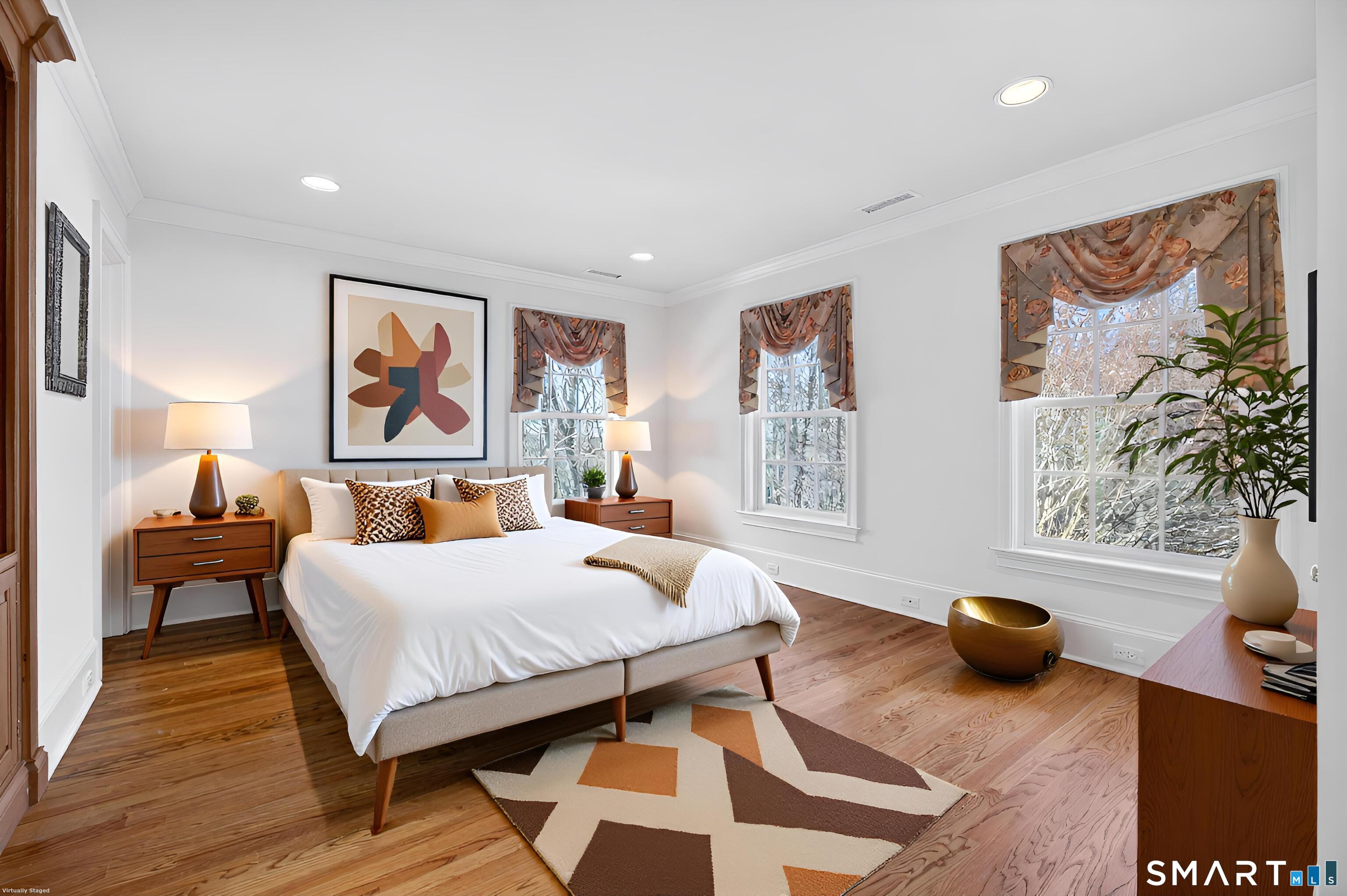 134 River Road Essex, CT 06426 - Photo 31 of 39 a bedroom with furniture and a wooden floor