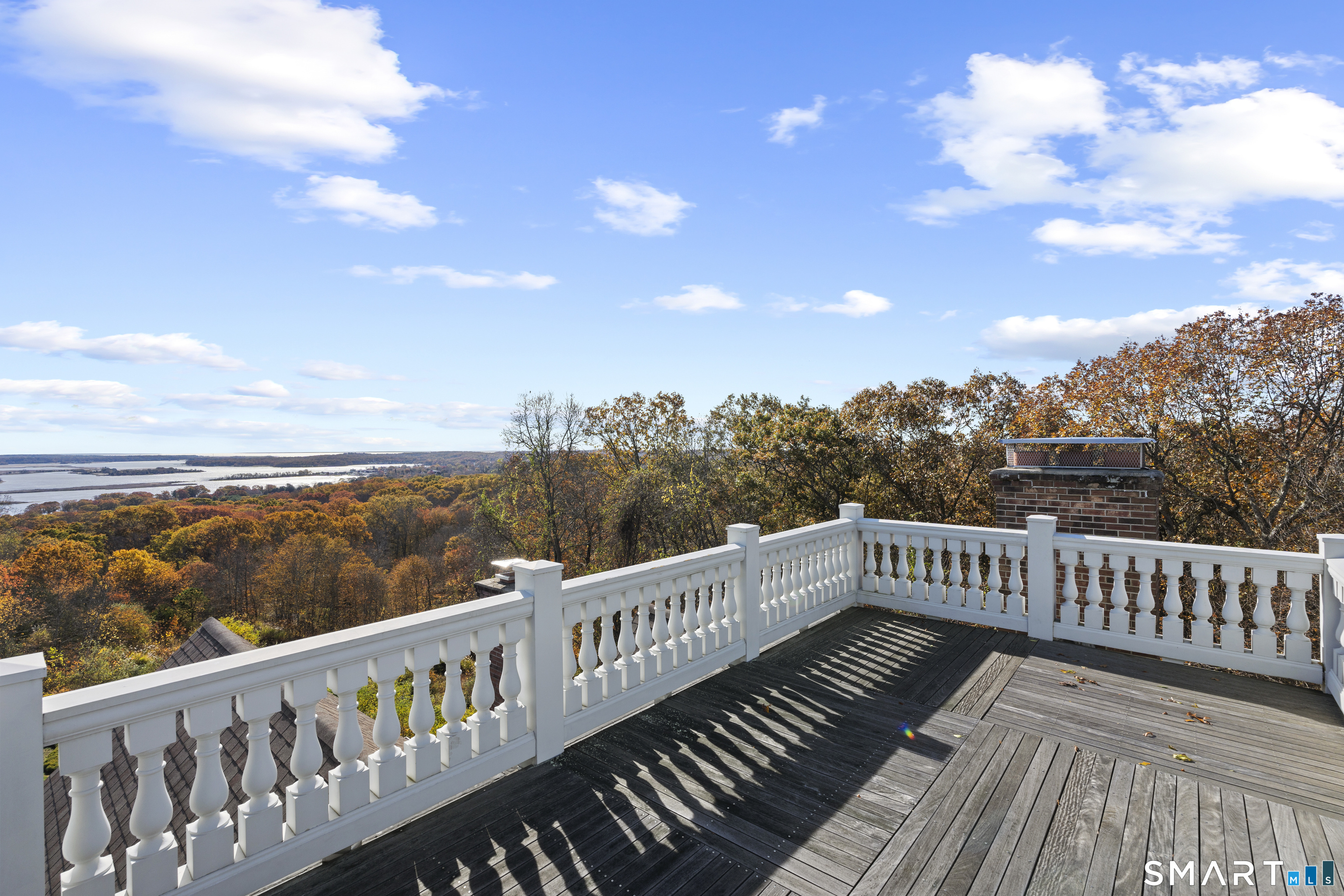 134 River Road Essex, CT 06426 - Photo 34 of 39 a view of a balcony with wooden fence