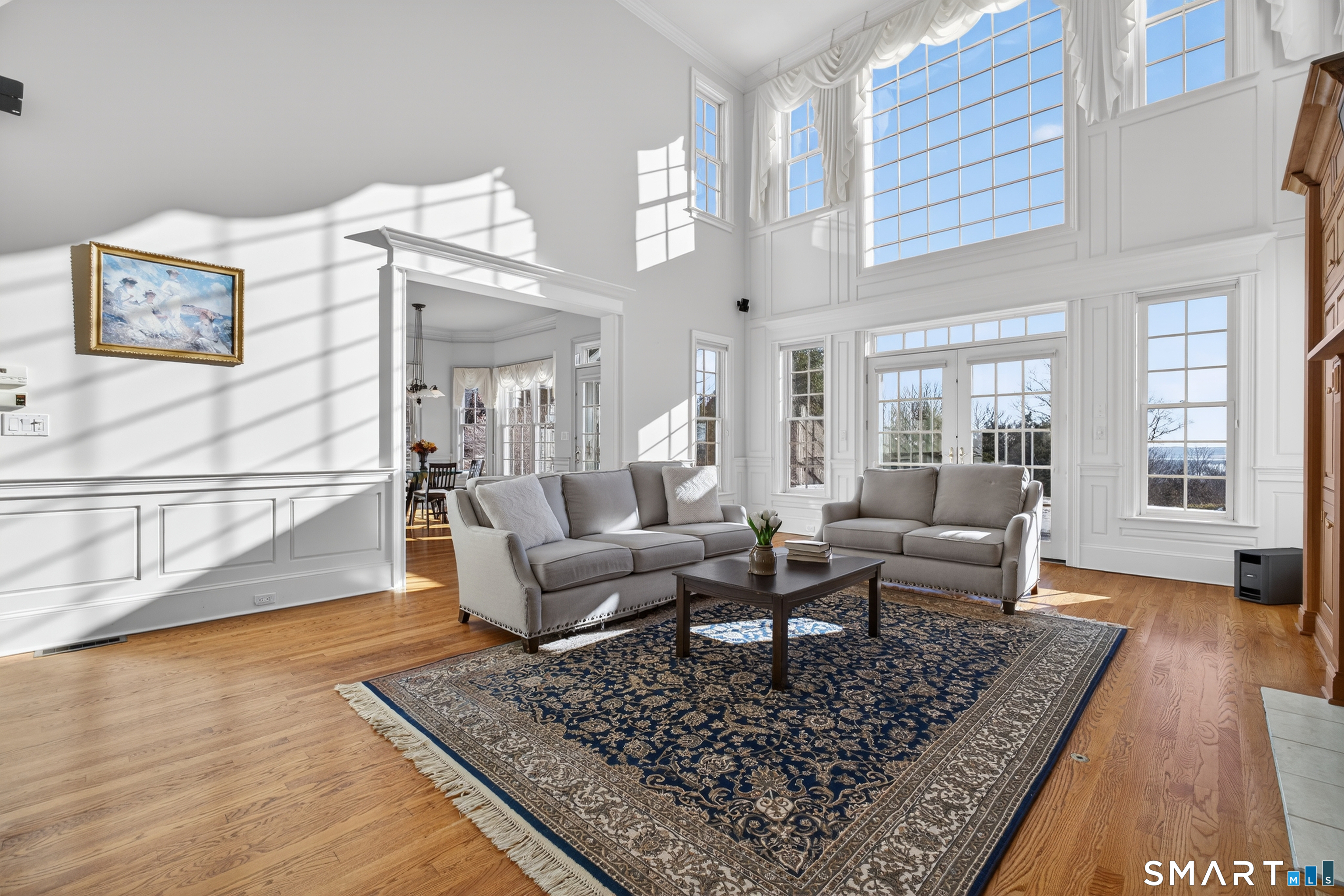 134 River Road Essex, CT 06426 - Photo 8 of 39 a living room with furniture and a rug