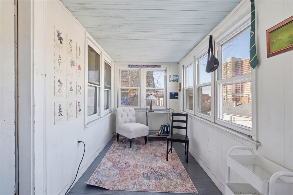 14 Stockwell Street, Unit 2 Boston, MA 02120 - Photo 13 of 29 a living room with furniture and a rug