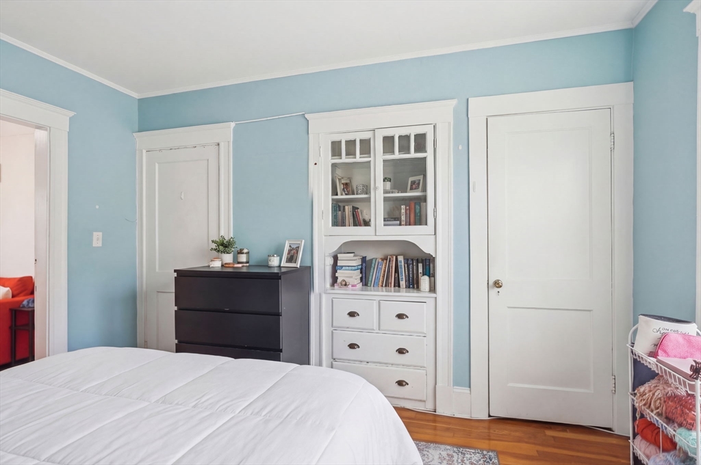 14 Stockwell Street, Unit 2 Boston, MA 02120 - Photo 16 of 29 a bedroom with a bed and a dresser