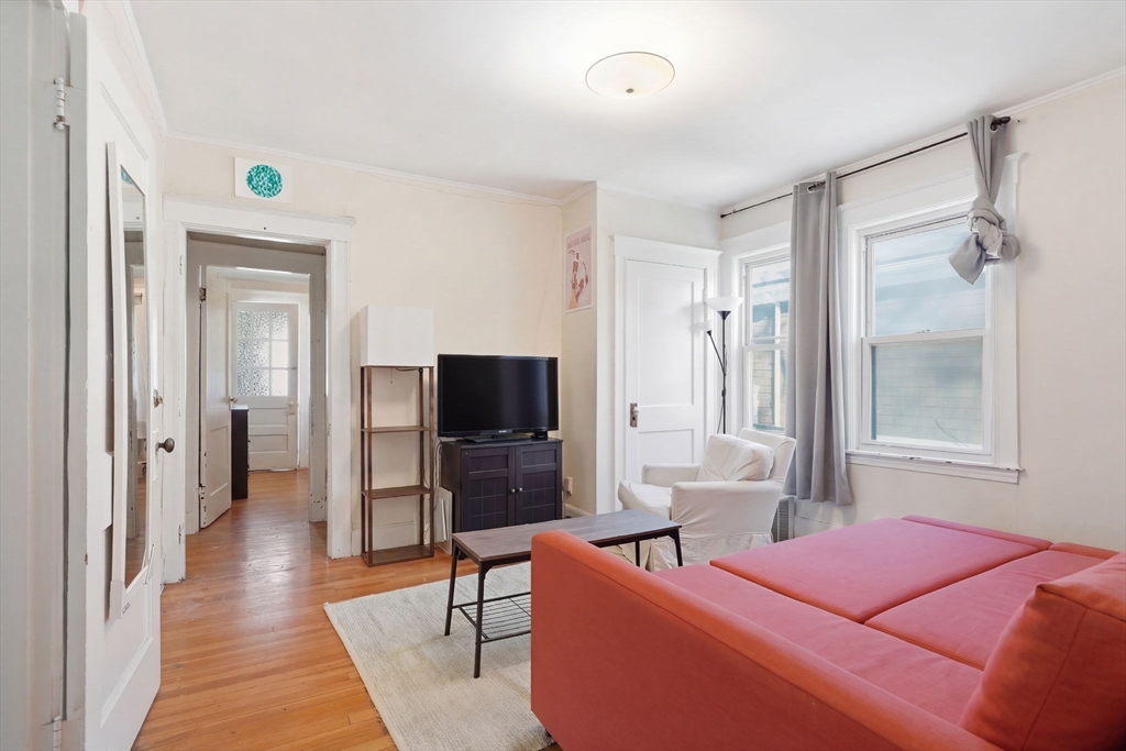 14 Stockwell Street, Unit 2 Boston, MA 02120 - Photo 18 of 29 a living room with furniture and a flat screen tv