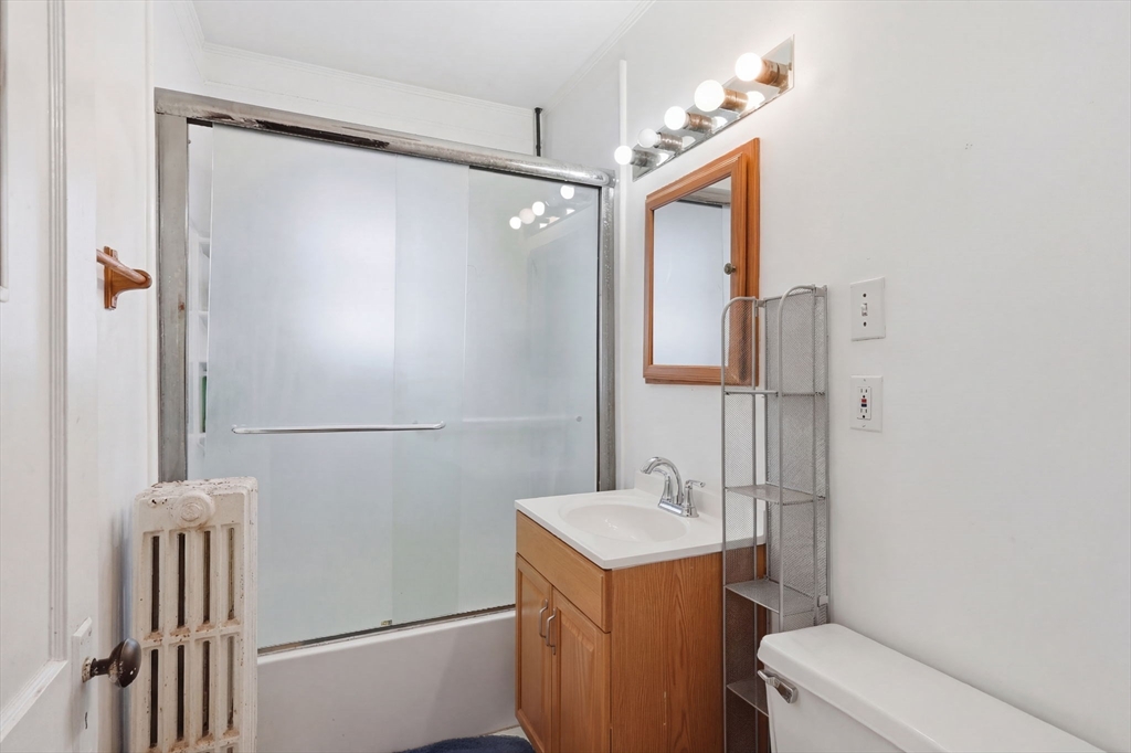 14 Stockwell Street, Unit 2 Boston, MA 02120 - Photo 19 of 29 a bathroom with a sink and a mirror