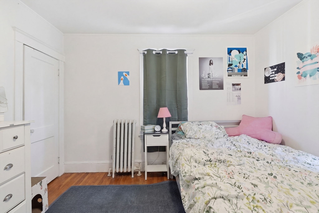 14 Stockwell Street, Unit 2 Boston, MA 02120 - Photo 21 of 29 a bedroom with a bed and a window
