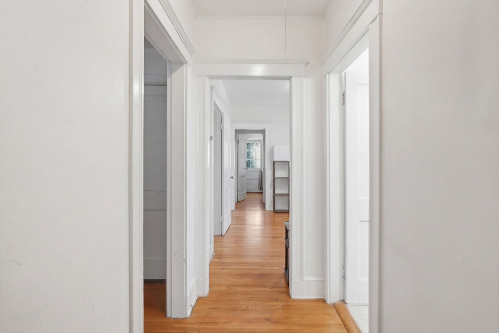 14 Stockwell Street, Unit 2 Boston, MA 02120 - Photo 23 of 29 a view of a hallway with wooden floor