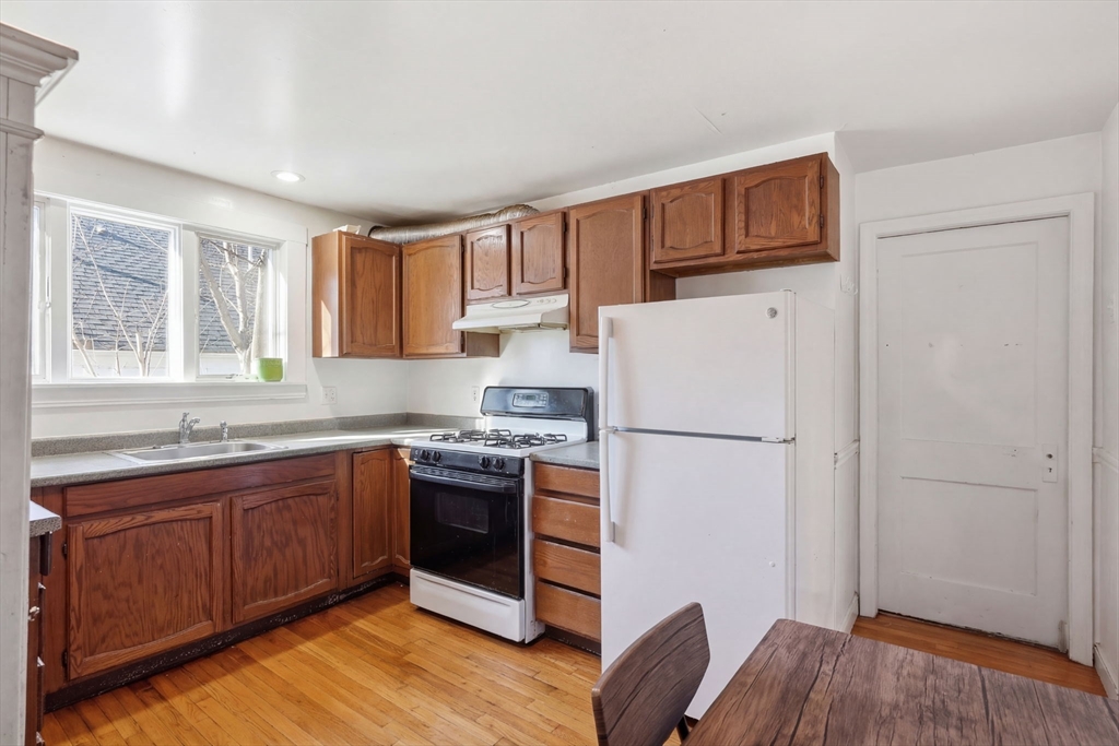 14 Stockwell Street, Unit 2 Boston, MA 02120 - Photo 26 of 29 a kitchen with stainless steel appliances a refrigerator and a sink