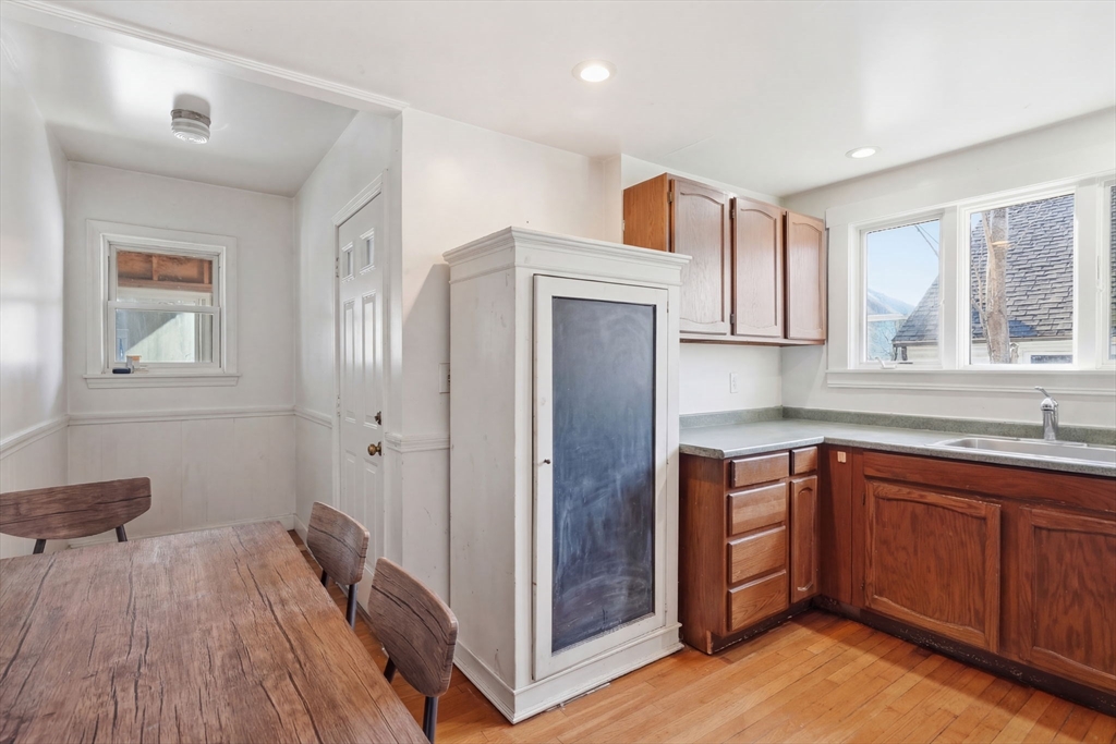 14 Stockwell Street, Unit 2 Boston, MA 02120 - Photo 28 of 29 a kitchen with cabinets a sink and wooden floor