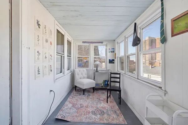a living room with furniture and a rug