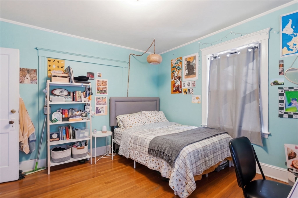 14 Stockwell Street, Unit 2 Boston, MA 02120 - Photo 5 of 29 a bedroom with a bed furniture and a book shelf