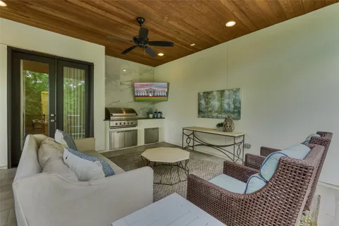 a view of a patio with a table chairs and a table