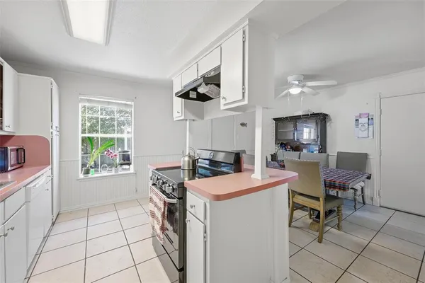 a view of kitchen and sink