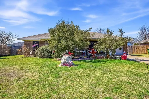 a view of a garden in front of the house