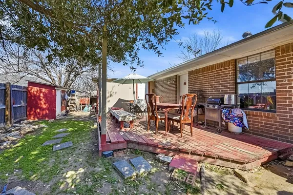 a view of a backyard with a patio