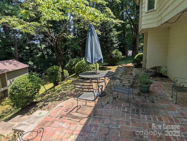 110 Hillside Court Tryon, NC 28782 - Photo 11 of 11 a view of backyard with table and chairs and potted plants