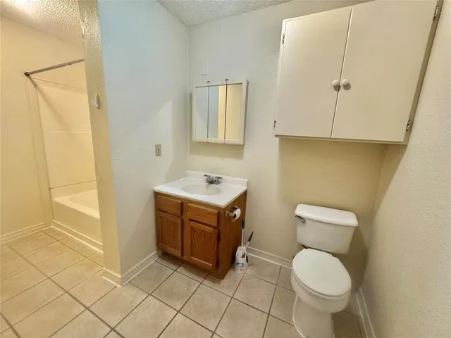 a bathroom with a sink toilet and vanity
